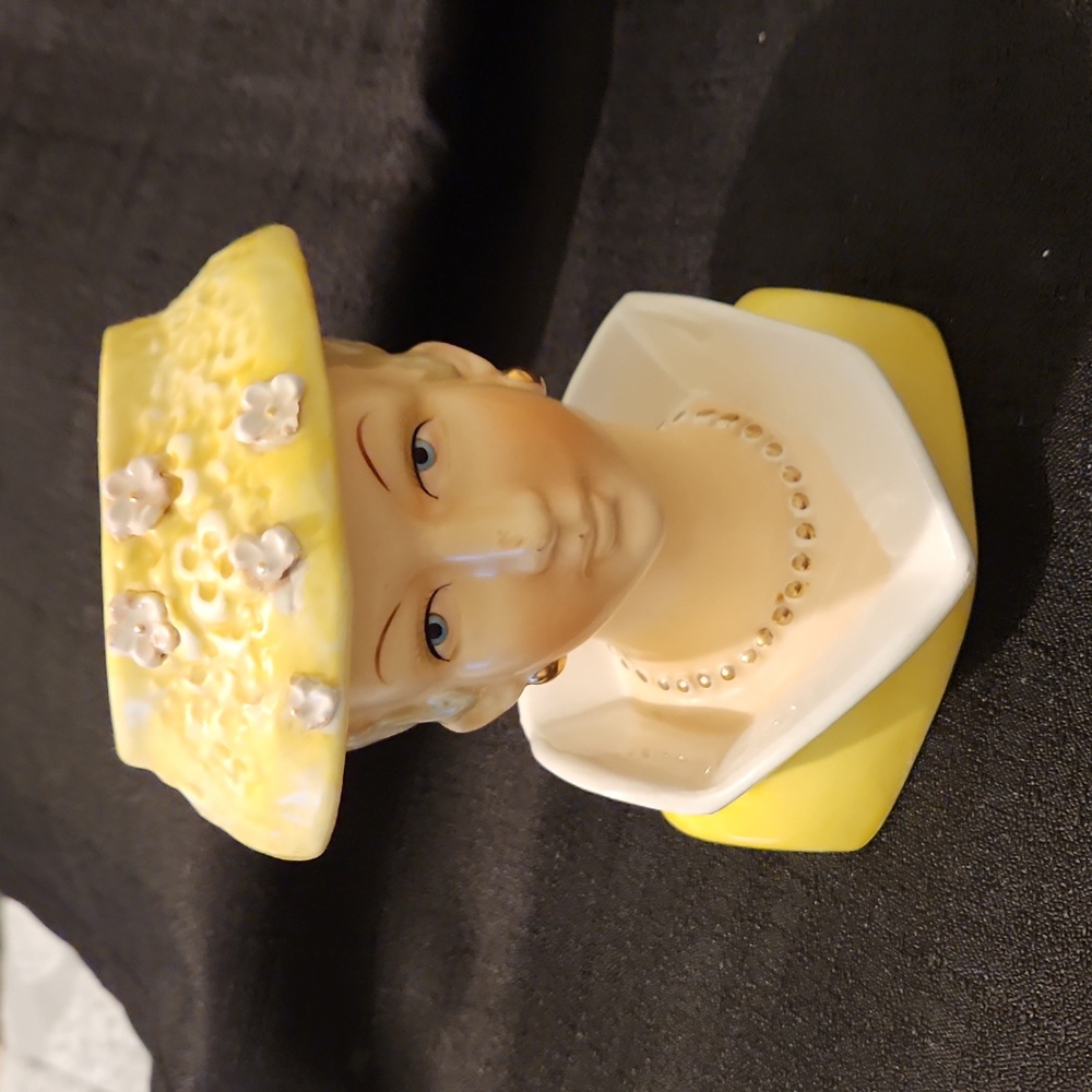 VINTAGE LADY HEAD VASE IN YELLOW DRESS AND FLOWER HAT(FEW PETALS MISSING).